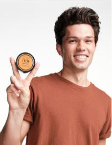Model holding Matte Clay Puck